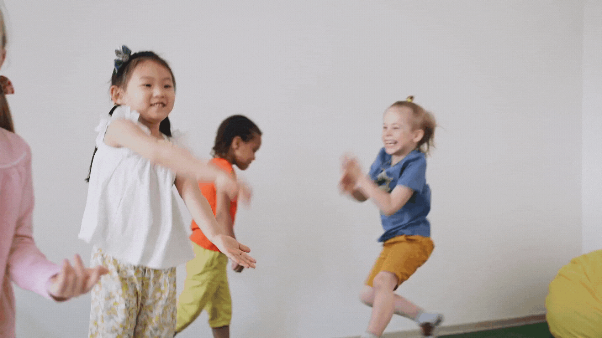 GIF of children jumping and dancing